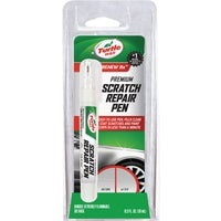 Picture of a scratch repair pen in packaging.