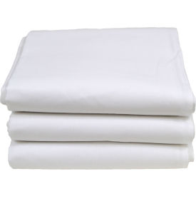Image of a stack of white bed linens.